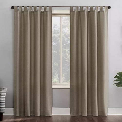 Calypso Clifford Tab Top Window Curtains in a neutral color, hanging gracefully over a window