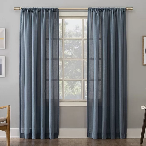 Linen Blend Textured Semi-Sheer Rod Pocket Curtain Panels hanging gracefully on a window